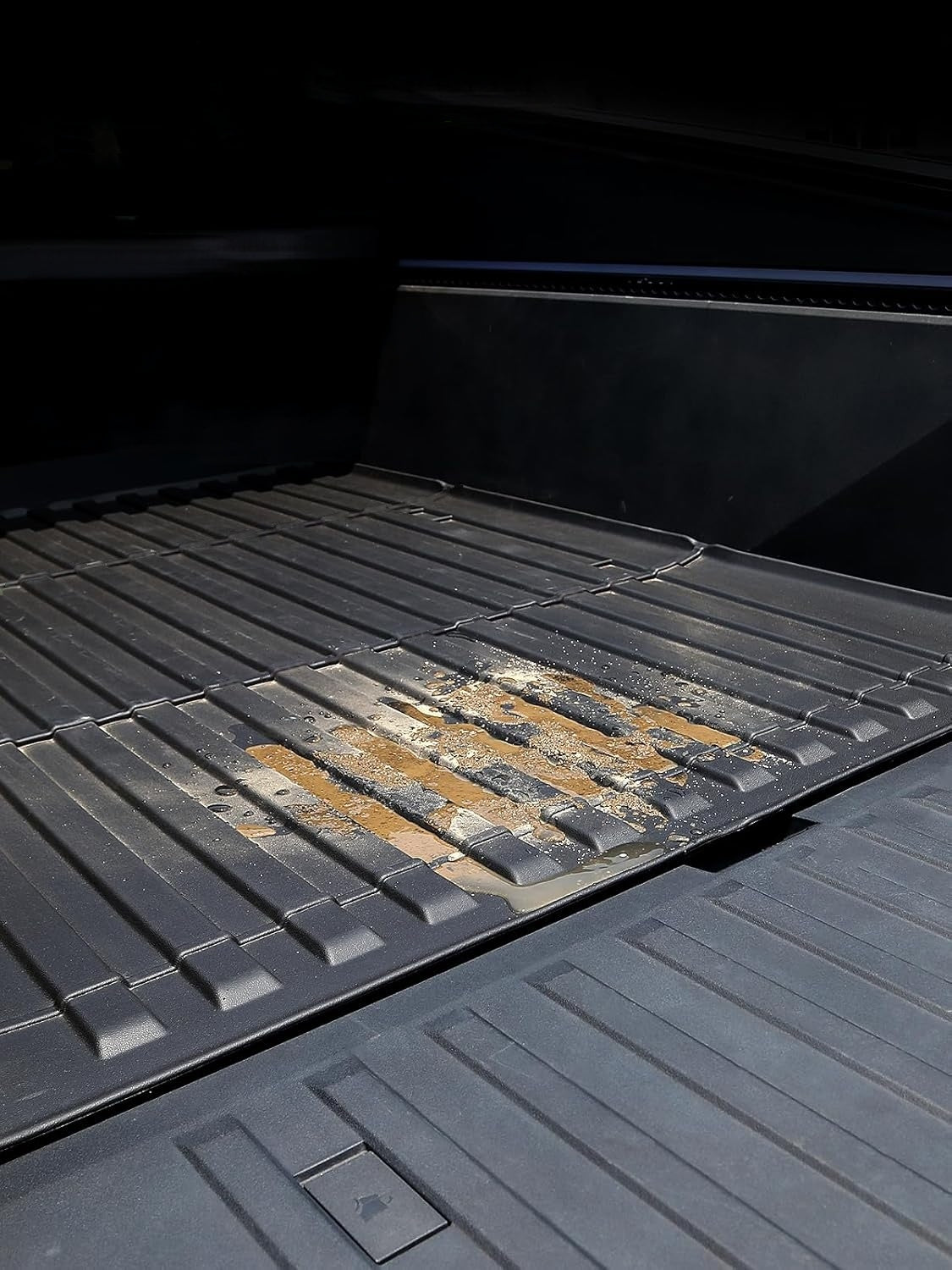 OEM Cybertruck cargo bed vs. TPE mat – custom-cut edges align perfectly with factory grooves for flush fit